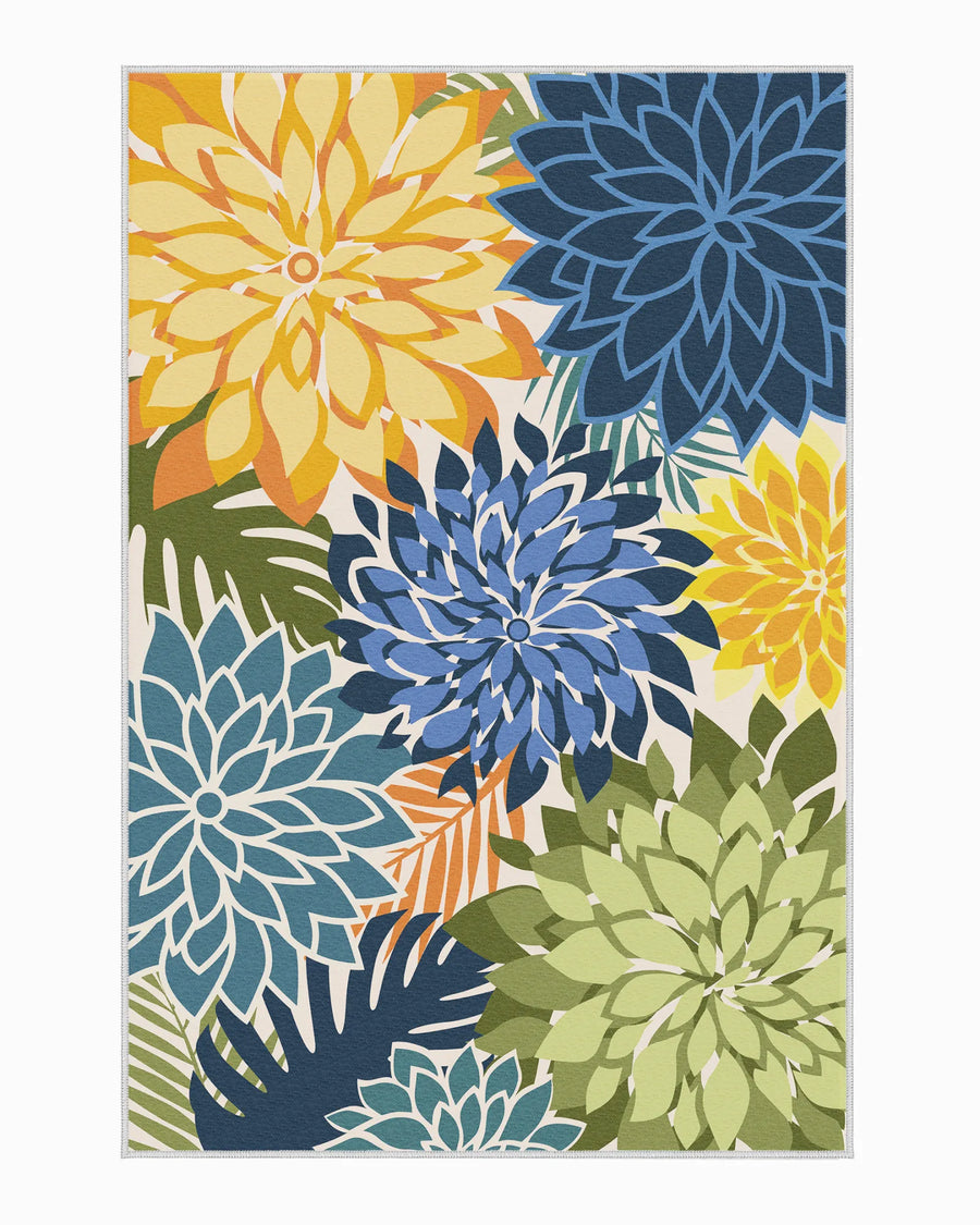 Washable Floral outdoor rug with oversized blue, yellow, and green dahlia pattern