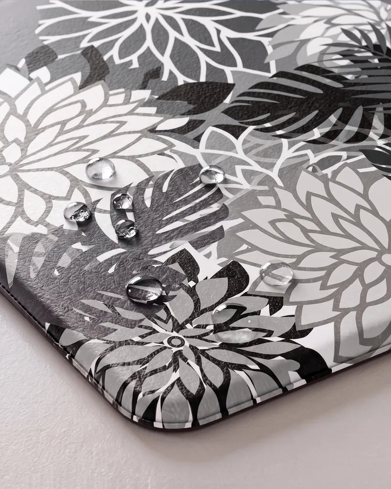 Water droplets on Black White floral anti-fatigue kitchen mat showing its waterproof surface