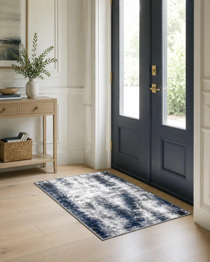 Blue gray abstract entryway rug in front of modern double doors