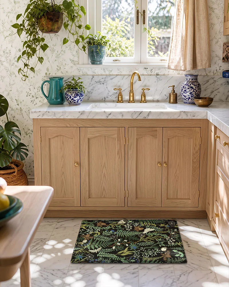 Ink Moss Green botanical anti-fatigue mat placed at a farmhouse kitchen sink