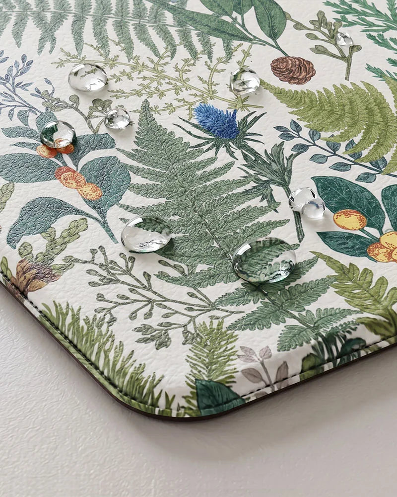 Creamy White botanical kitchen mat close-up with water-resistant cushioned surface