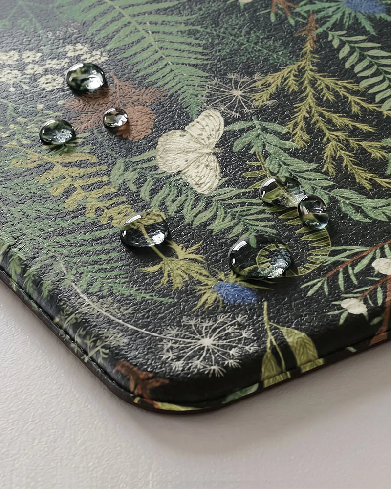 Ink Moss Green botanical kitchen mat close-up with water-resistant surface and cushioned beveled edge