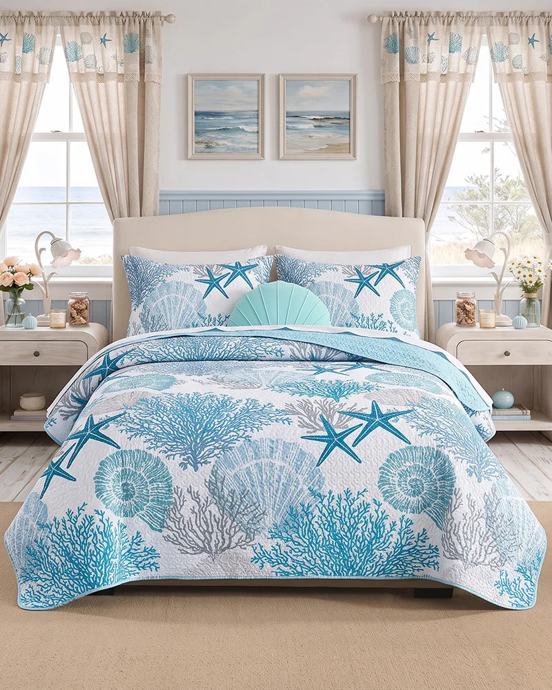 Blue coastal bedspread with coral and starfish in a nautical window bedroom