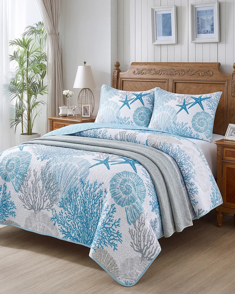 Coastal quilt set with aqua coral print in a traditional wood bedroom