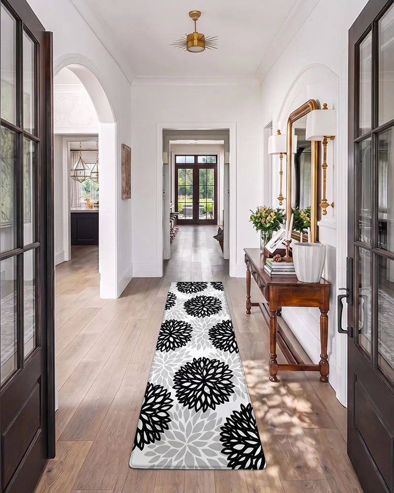 Black Gray dahlia floral anti-fatigue kitchen mat set in a bright hallway