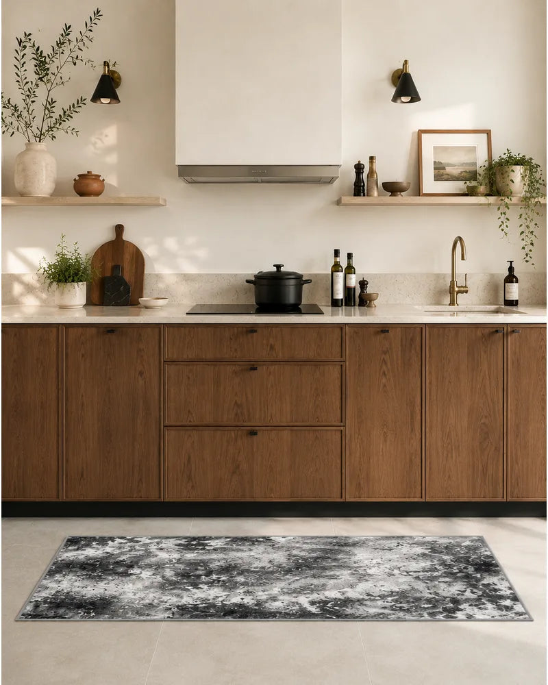 Gray washable abstract kitchen rug set by the sink with wood cabinets