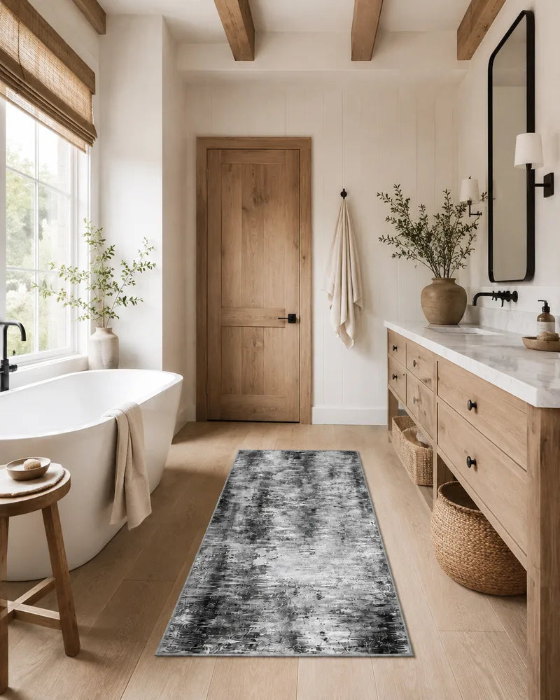Gray non-slip abstract runner rug on a bathroom floor in natural light