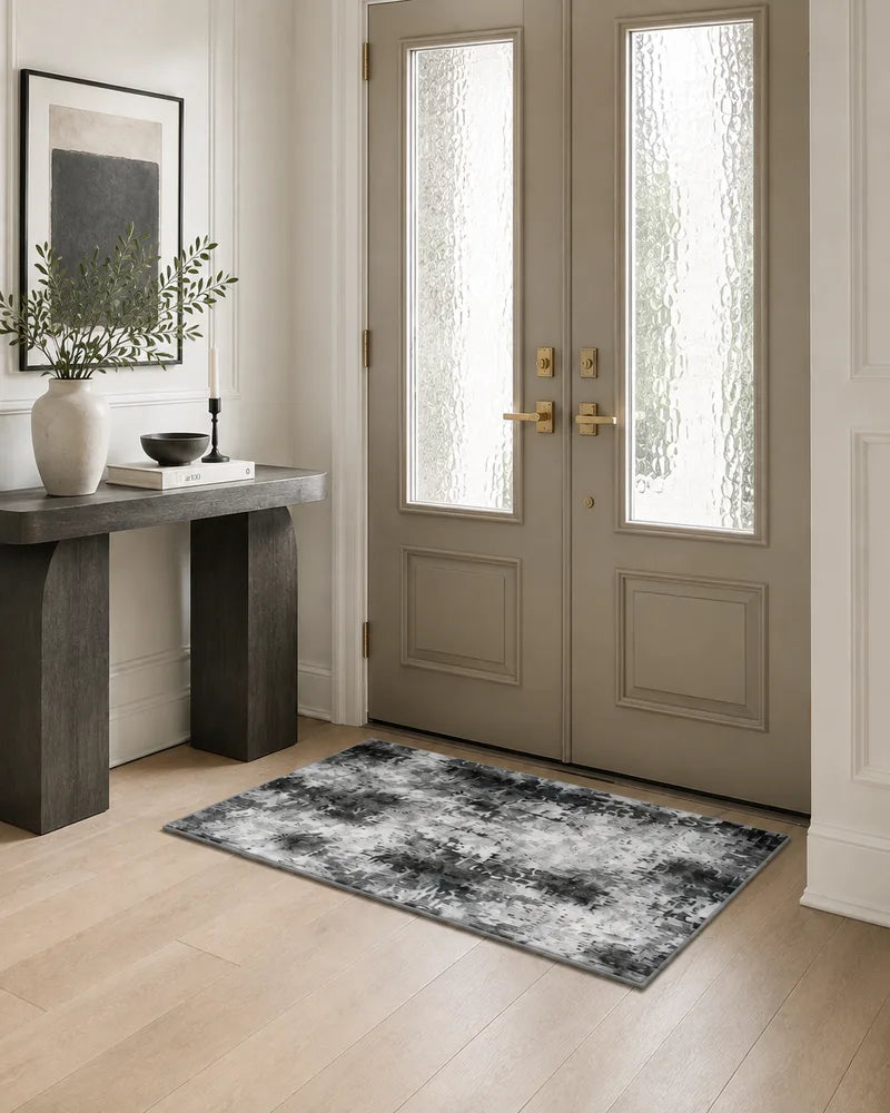 Gray non-slip abstract entryway rug beside frosted glass doors