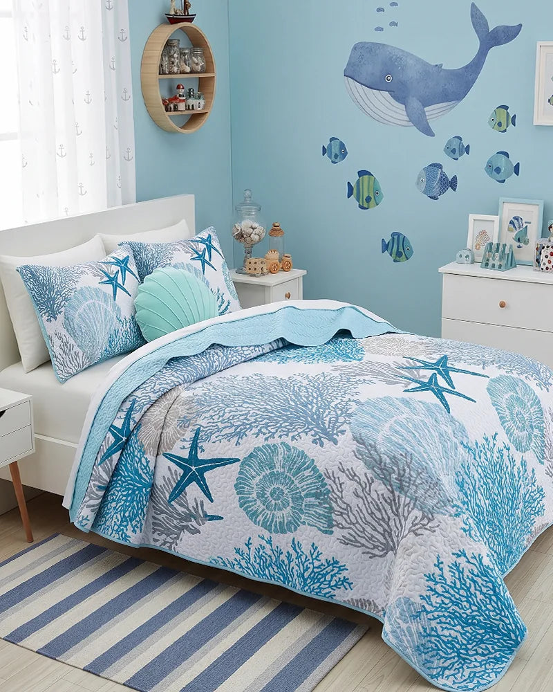 Ocean quilt set with coral and starfish in a blue whale-themed kids bedroom
