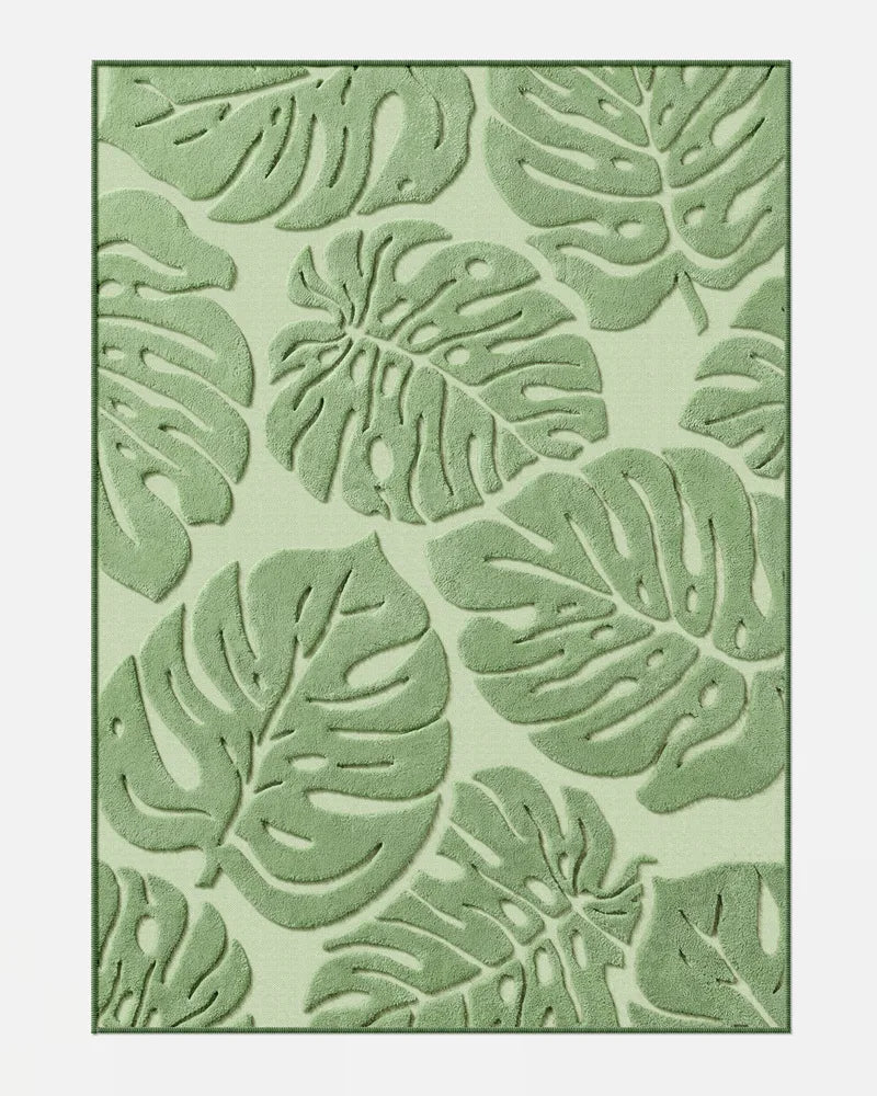 Sage green Monstera washable area rug with raised leaf texture in 5 x 7 size