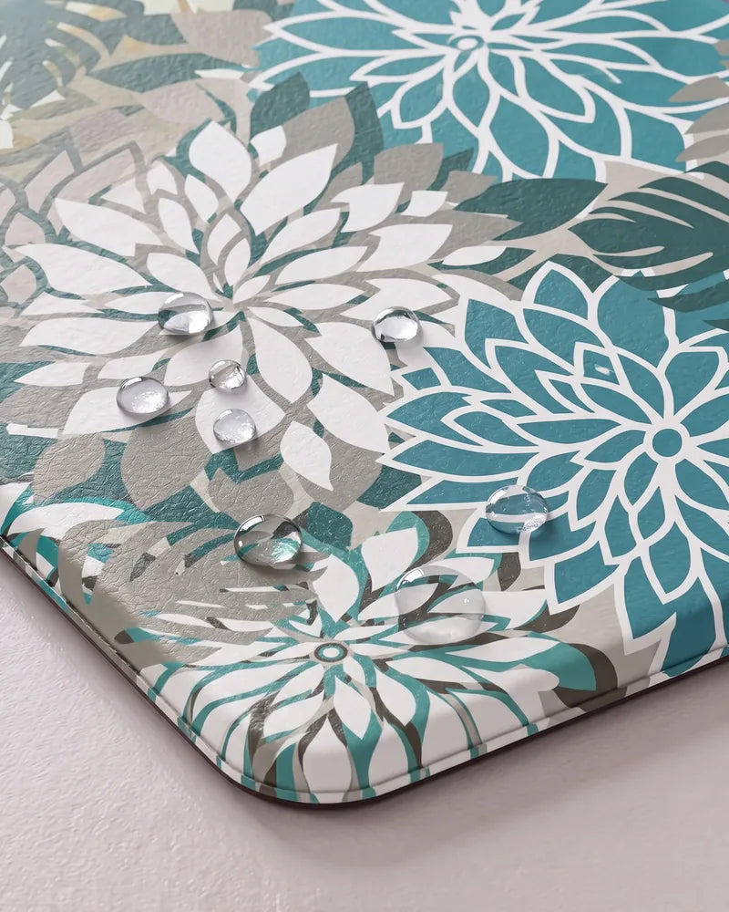Water droplets on Teal floral anti-fatigue kitchen mat showing its waterproof surface