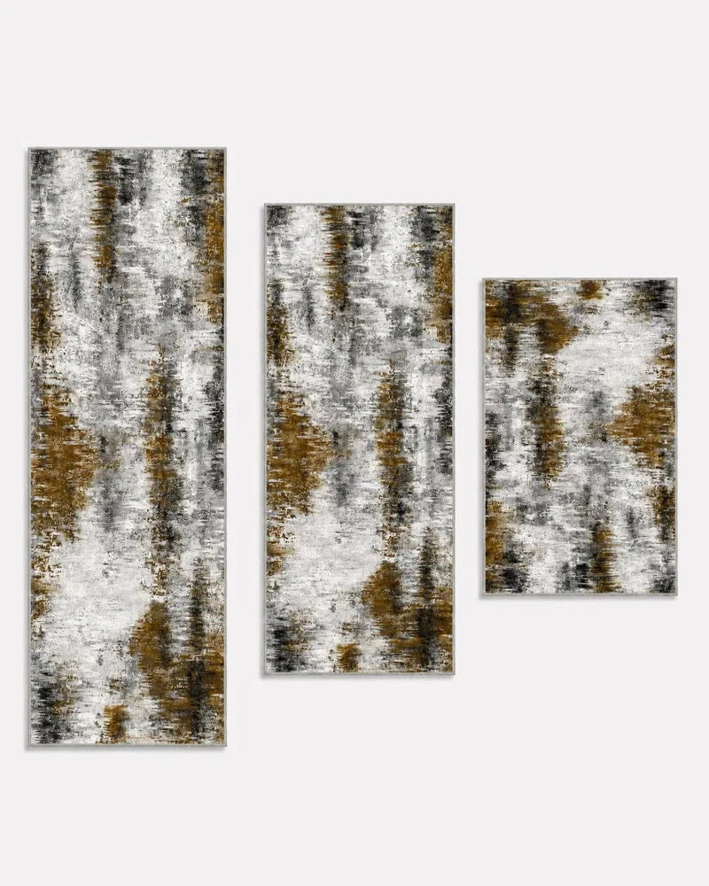 Black gray and gold washable non-slip kitchen rug set of three, shown longest to shortest: 20 x 59, 20 x 48, and 20 x 32 inches
