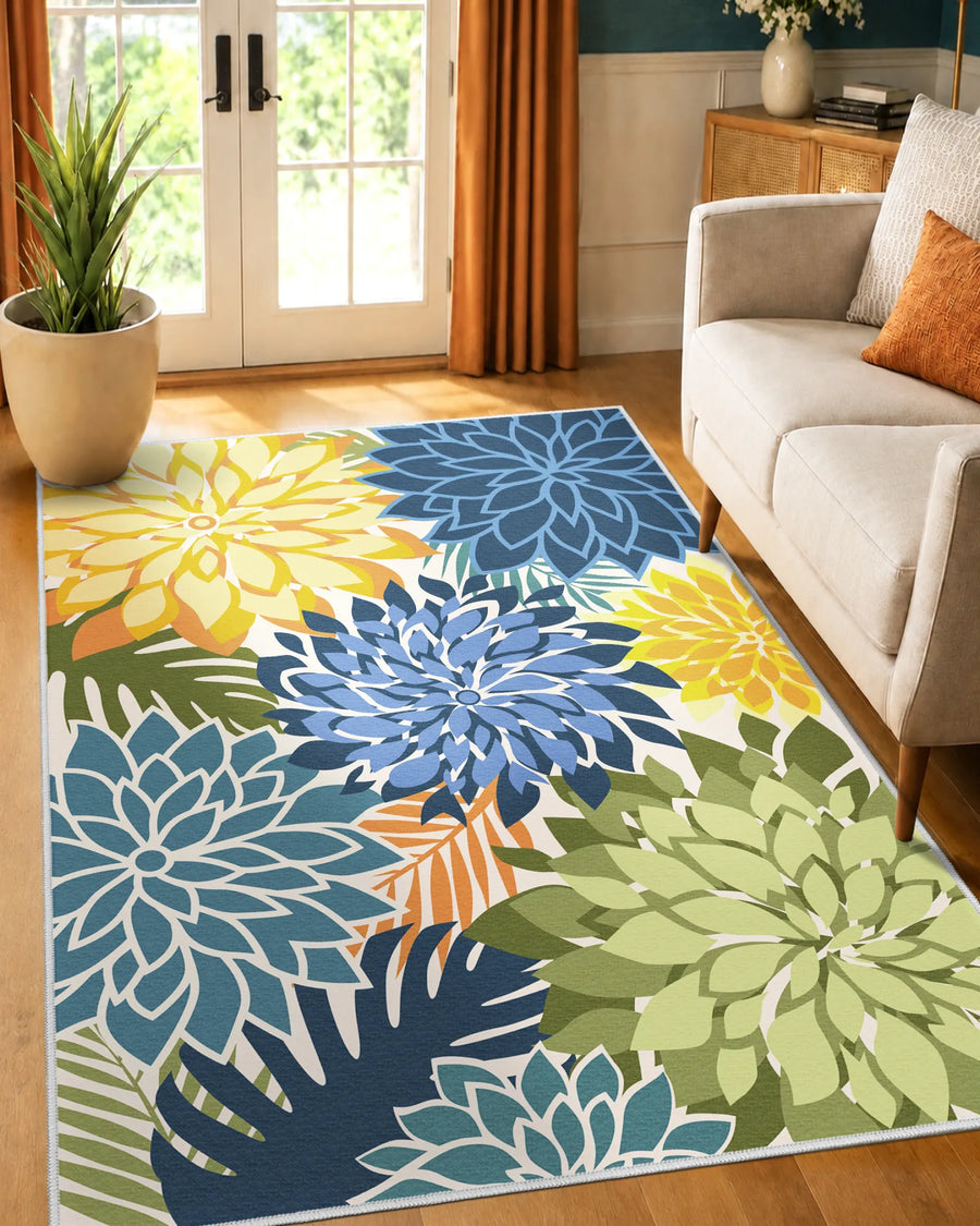 Washable floral area rug styled beside an armchair in a bright indoor space