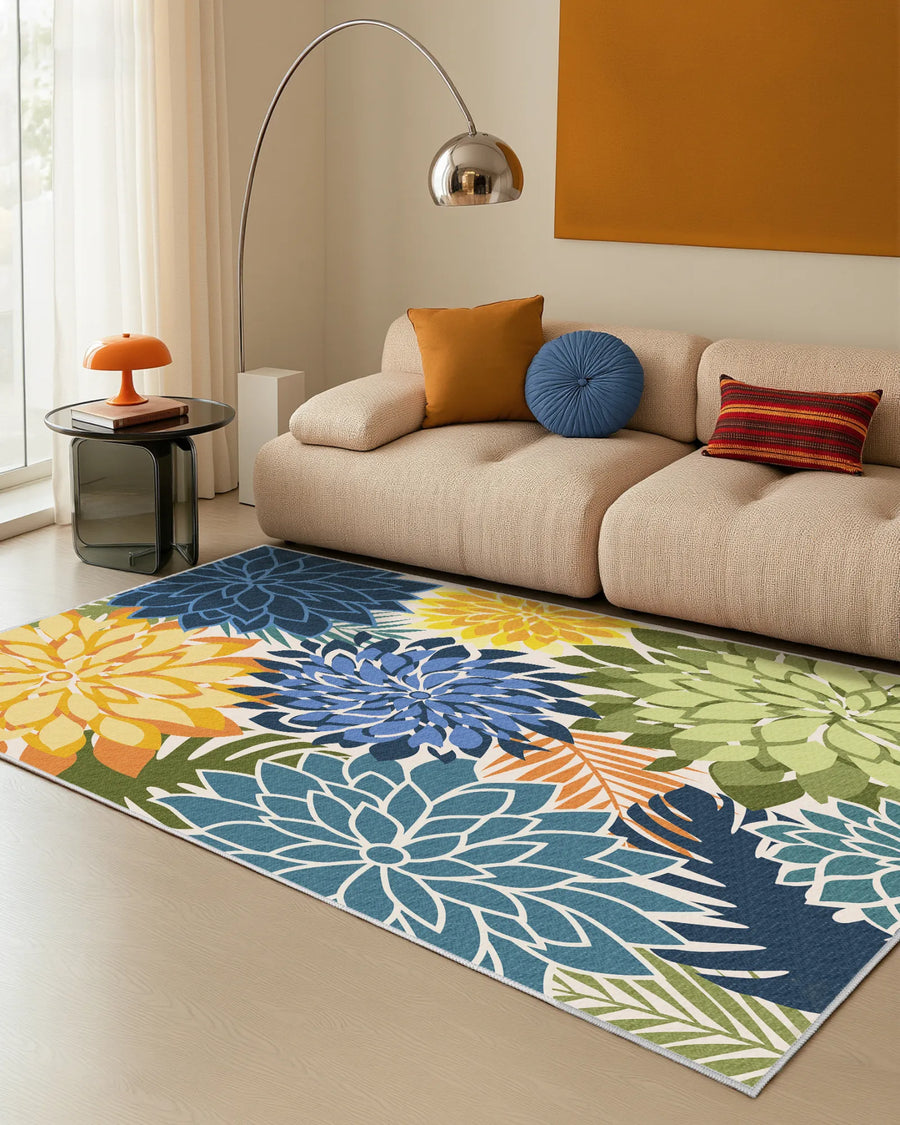 Floral area rug with blue, yellow, and green dahlias in a modern living room
